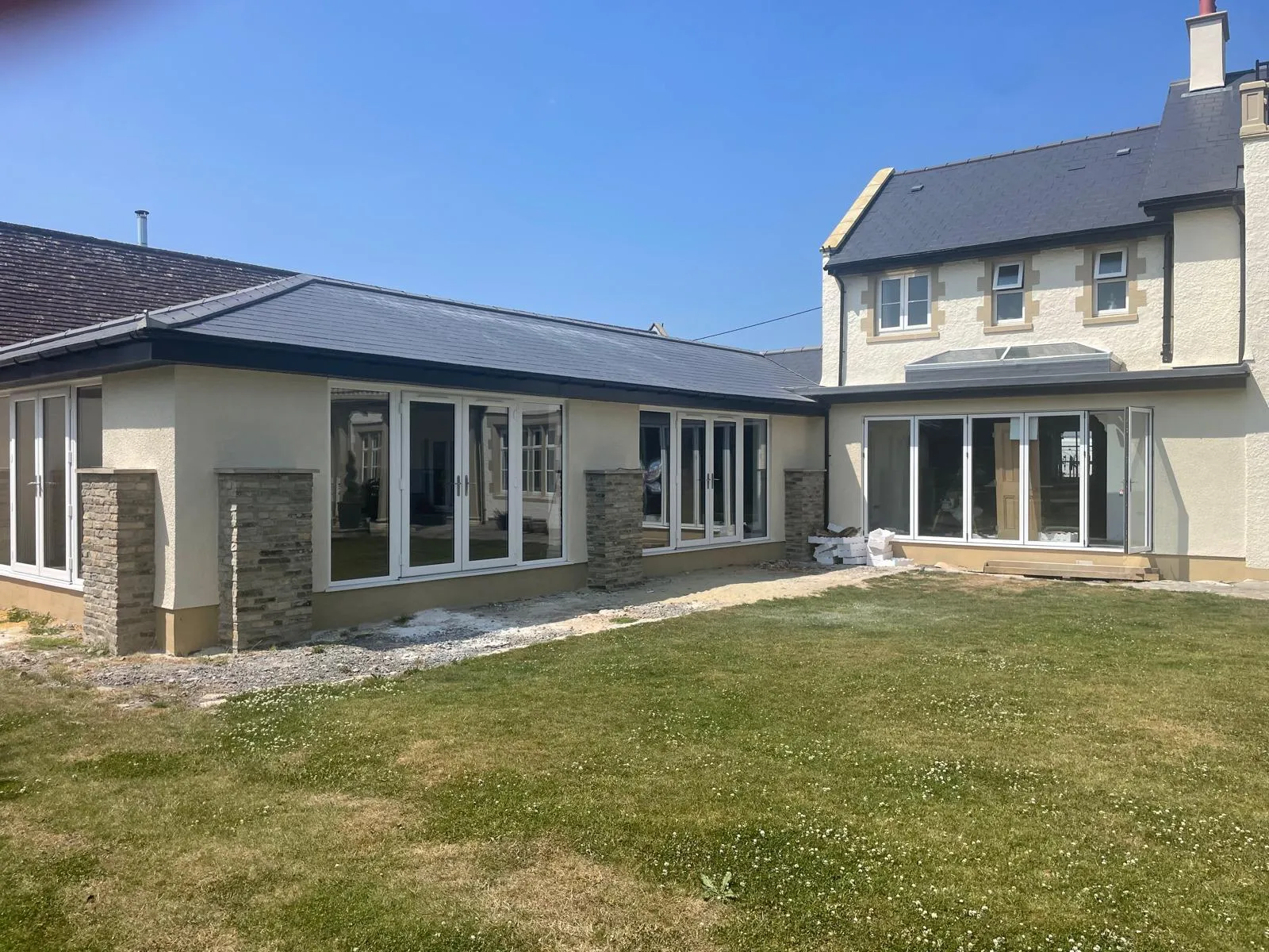 Rear extension with bi-fold doors and a new slate roof