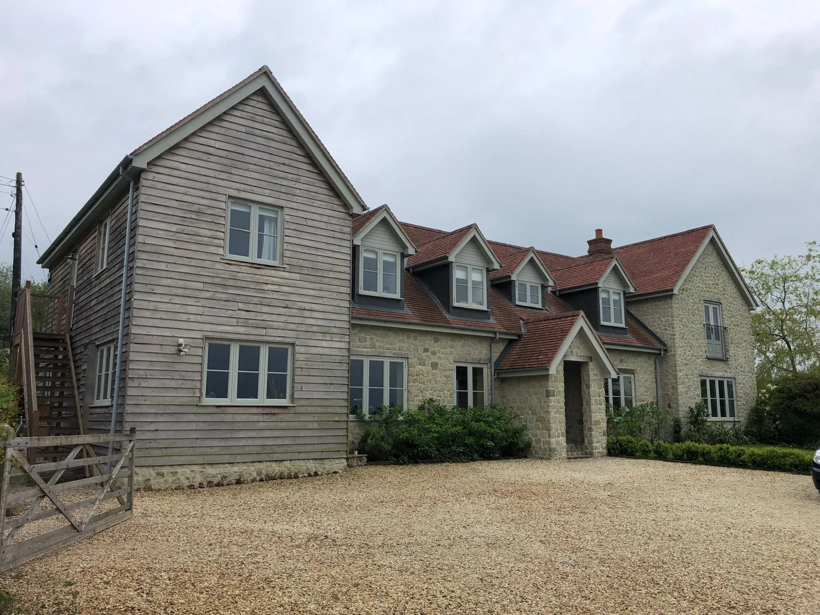 Cedar-clad and stone building completed by PK Building Contractor