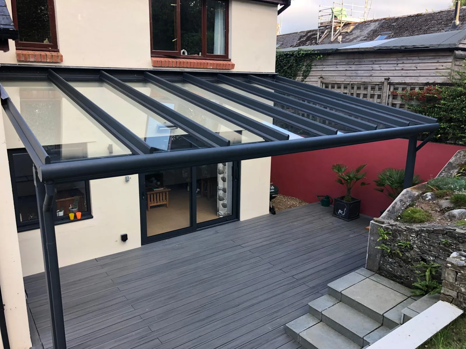 Aluminium and glass roof over composite decking and steps
